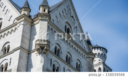 Architecture - Neuschwanstein Castle White Stone Facade with Arched Windows Towers and Spires Against Blue Sky 138039566
