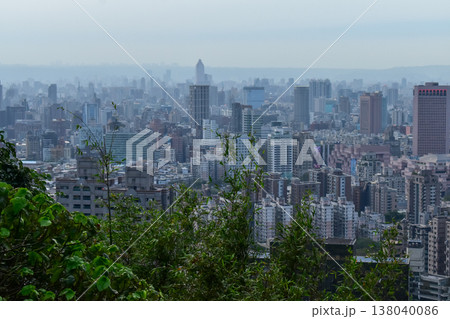 Aerial view of skyline of Taipei city at sunset from Xiangshan Elephant Mountain with colorful sky. Beautiful landscape and cityscape of Taipei downtown buildings and architecture in the city 138040086