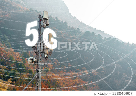 5G internet tower located in a mountainous area with signals broadcasting in the air 138040907