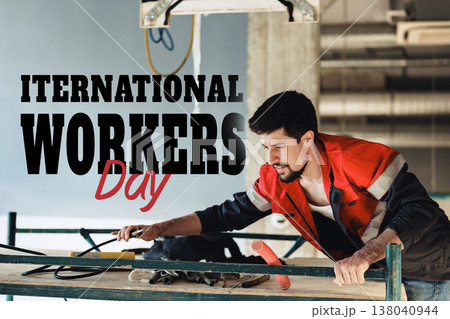 Celebration of International Workers Day with a worker on a construction site on May 1 Celebration of International Workers Day with a worker on a construction site on May 1 138040944