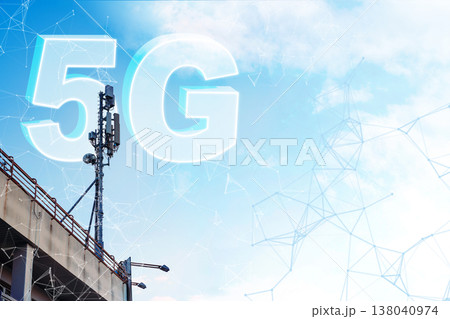 5G internet network tower stands tall against a blue sky with clouds 138040974