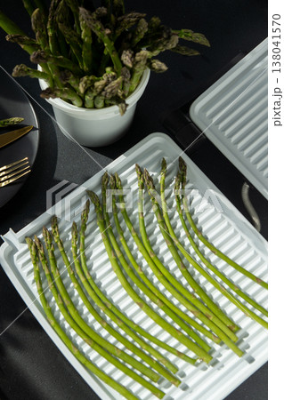 Bunch of green asparagus sprout. Fresh spring vegetable food on grill. 138041570