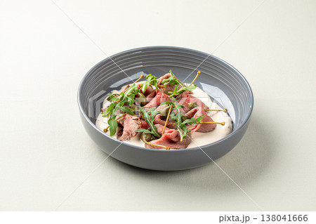 Veal carpaccio with capers and creamy sauce 138041666