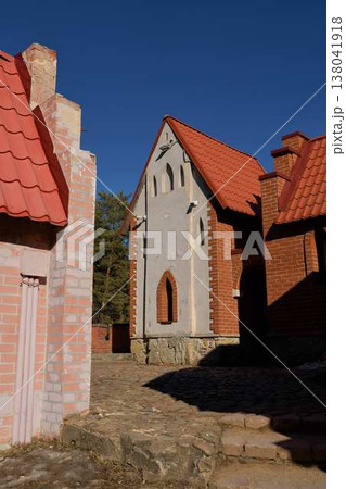 Quiet And Secluded Street Displaying Illuminated Cobblestones Alongside Charming Architectural Ornamentation Quiet And Secluded Street Displaying Illuminated Cobblestones Alongside Charming Architectural Ornamentation 138041918