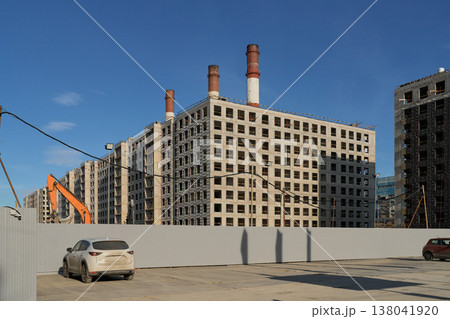 Urban Building Progress. Construction Zone Under Blue Sky. City Redevelopment With Cranes And Structures 138041920