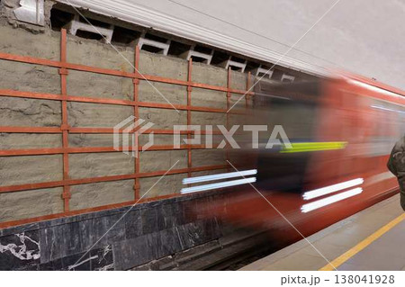 Fast Moving Commuter Train Scene. Rapid City Train With Streaks And Rushing Passenger Figures Captured 138041928