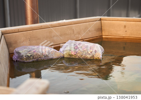 Elegant Floral Sachets Gently Drifting On Water Create Romantic Spa Ambiance For Couples Or Weddings Elegant Floral Sachets Gently Drifting On Water Create Romantic Spa Ambiance For Couples Or Weddings 138041953