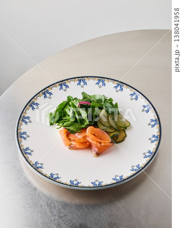 Lightly dressed salad featuring salmon and crisp vegetables Lightly dressed salad featuring salmon and crisp vegetables 138041958