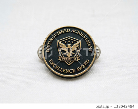 Metal award pin with eagle emblem for distinguished achievement and excellence with white background 138042484