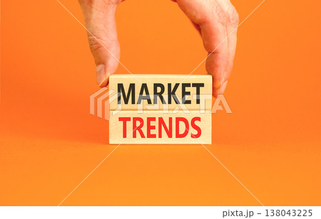 Market trends words symbol. Concept words Market trends on beautiful wooden blocks. Beautiful orange background. Businessman hand. Business and Market trends words concept. Copy space. Market trends words symbol. Concept words Market trends on beautiful wooden blocks. Beautiful orange background. Businessman hand. Business and Market trends words concept. Copy space. 138043225
