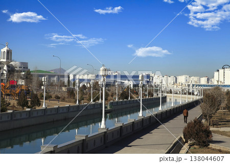 ASHGABAT, TURKMENISTAN, January 25, 2022: Modern architecture of Ashgabat. View of the water channel. ASHGABAT, TURKMENISTAN, January 25, 2022. ASHGABAT, TURKMENISTAN, January 25, 2022: Modern architecture of Ashgabat. View of the water channel. ASHGABAT, TURKMENISTAN, January 25, 2022. 138044607