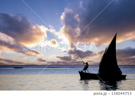 sailboat at sunset in Mauritius island sailboat at sunset in Mauritius island 138044753