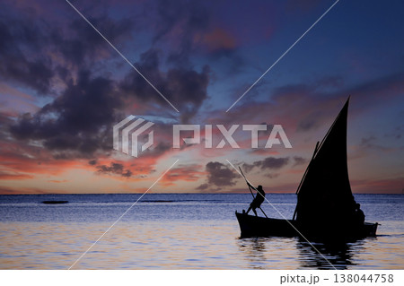 sailboat at sunset in Mauritius island sailboat at sunset in Mauritius island 138044758