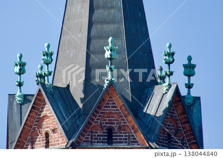 Historic Gothic Revival Church Spire with Verdigris Copper Finials and Brick Gables. 138044840