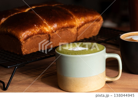 Coffee cups with delicious bread on a wooden table Coffee cups with delicious bread on a wooden table 138044945