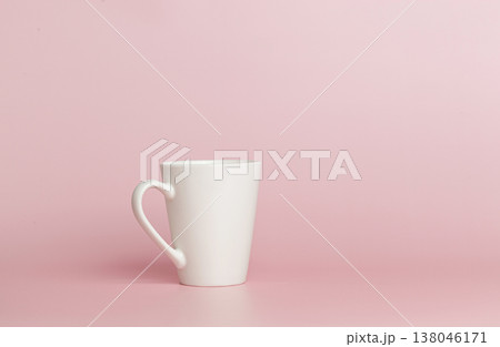 white cup for tea or coffee on a pink background white cup for tea or coffee on a pink background 138046171