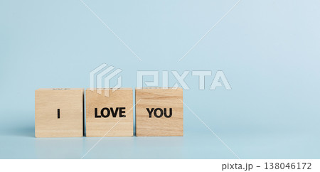 Wooden cubes with inscriptions I Love You on a blue background Wooden cubes with inscriptions I Love You on a blue background 138046172