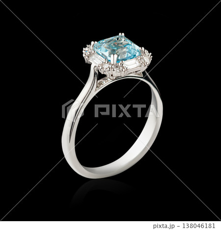 Beautiful white gold ring with diamonds and aquamarine on a black background Beautiful white gold ring with diamonds and aquamarine on a black background 138046181