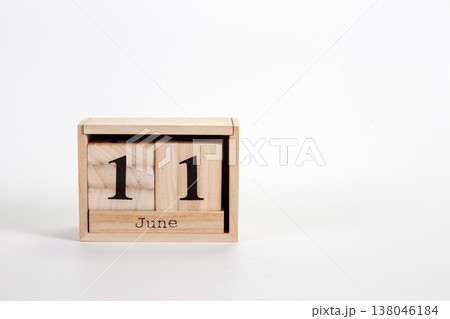 Wooden calendar June 11 on a white background Wooden calendar June 11 on a white background 138046184