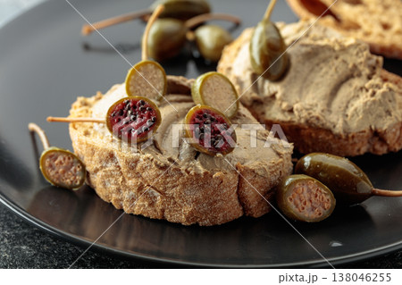 Bread with liver pate and capers. Bread with liver pate and capers. 138046255
