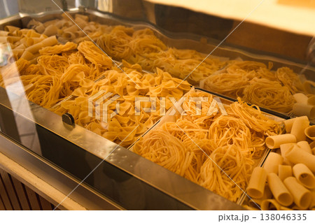 Traditional Italian pasta products displayed at the window of a local pasta shop in Roma, Italy. Traditional Italian pasta products displayed at the window of a local pasta shop in Roma, Italy. 138046335