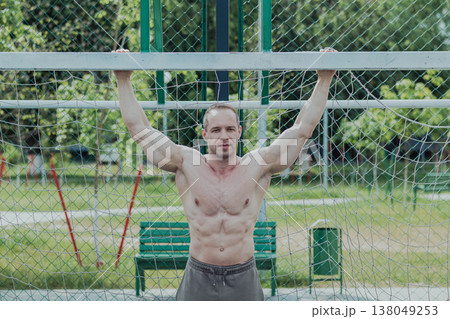 A CrossFit man poses for the camera on a sports 138049253