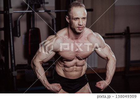 Bodybuilder posing in the gym, aesthetic body 138049309