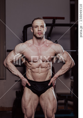 Bodybuilder posing in the gym, aesthetic body 138049310