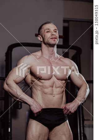 Bodybuilder posing in the gym, aesthetic body 138049315