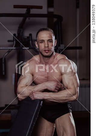 Bodybuilder posing in the gym, aesthetic body 138049379