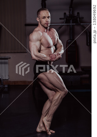 Bodybuilder posing in the gym, aesthetic body 138049692