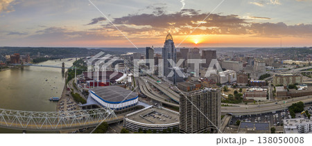 Urban landscape USA. Downtown district of Cincinnati in Ohio state in evening. American city skyline with brightly illuminated high commercial buildings Urban landscape USA. Downtown district of Cincinnati in Ohio state in evening. American city skyline with brightly illuminated high commercial buildings 138050008