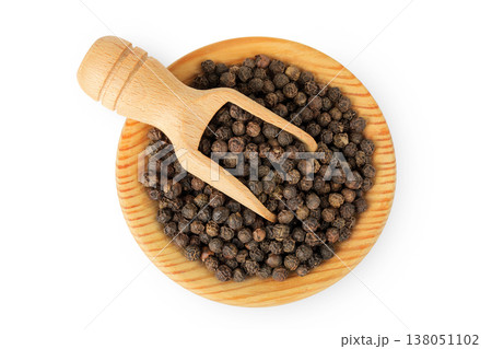Black peppercorns or pepper in a wooden bowl isolated on a white background. Top view. Flat lay Black peppercorns or pepper in a wooden bowl isolated on a white background. Top view. Flat lay 138051102