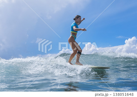Woman Sharpens Her Longboard Talents Beneath Clear Skies And Remote Islands 138051648