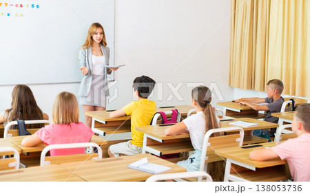 Kids listening to teacher Kids listening to teacher 138053736