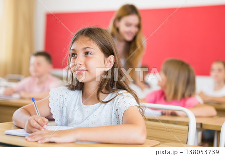 Children sitting in classroom 138053739
