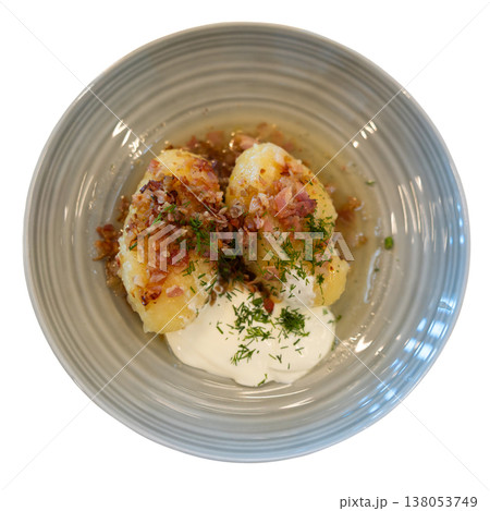 Cepelinai potato dumplings with sour cream and bacon bits 138053749