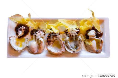 Tasty fried squid pieces seasoned with sauce and crispy chips Tasty fried squid pieces seasoned with sauce and crispy chips 138053785