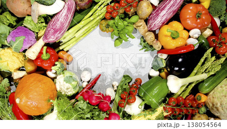 Fresh vegetables arranged on a table ready for cooking and meal preparation in a kitchen setting 138054564