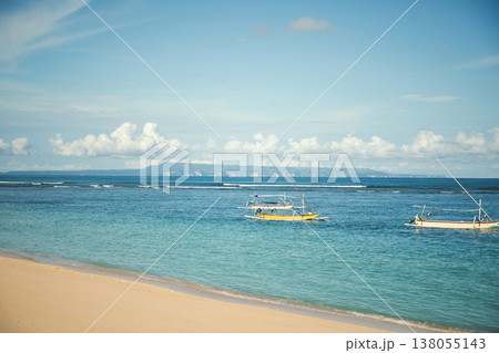 Boats are fishing in clear waters near Bali shore Boats are fishing in clear waters near Bali shore 138055143