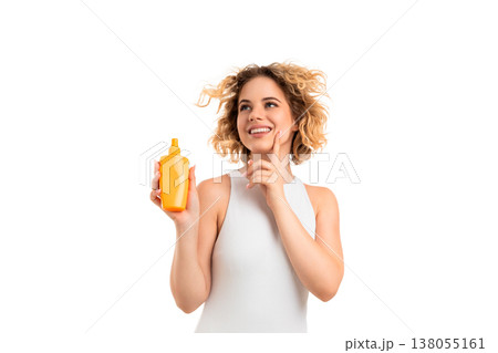 Girl smiles and holds sunscreen with curly hair, PNG 138055161