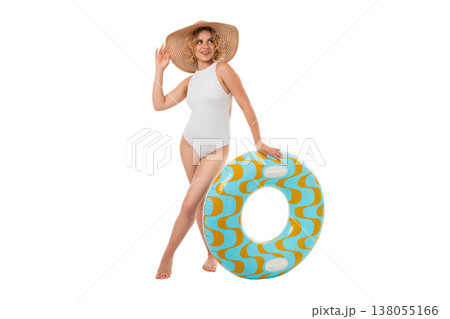 Woman in swimsuit stands by float at summer beach, PNG 138055166