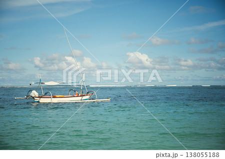 Boat drifting in clear water on a sunny day Boat drifting in clear water on a sunny day 138055188