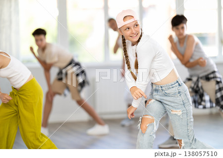 Teenage girl dancing hip hop in group Teenage girl dancing hip hop in group 138057510