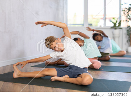 Boy stretches and prepares to perform Jana Shirshasana 138057563