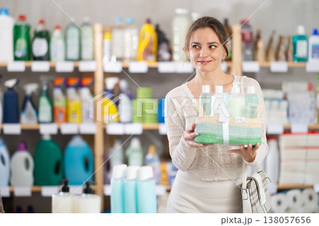 Young woman choosing gift basket in supermarket 138057656