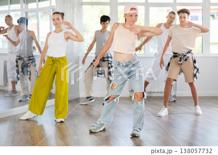 Teenage girl dancing jazz funk in group 138057732