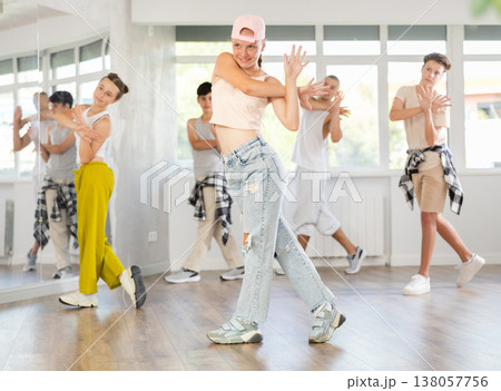Teenage girl dancing jazz funk in group Teenage girl dancing jazz funk in group 138057756