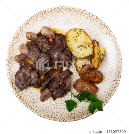 Chicken liver and heart served with potatoes 138057809