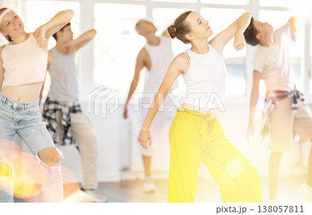 Teenage girl dancing jazz funk in group 138057811